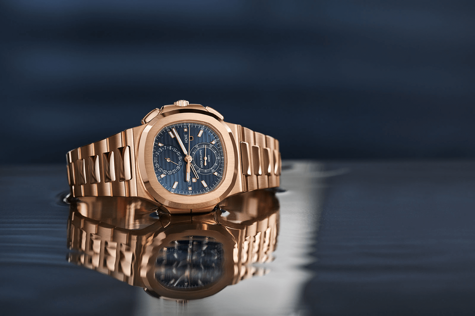 đồng hồ xa xỉ Patek philippe nautilus chronograph travel-time vàng nguyên khối